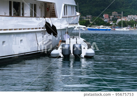 Vacation at sea. White expensive yacht moored in blue bay on Mediterranean. Picturesque bay, travels. Sunny summer day. Vacation at sea. White expensive yacht moored in blue bay on Mediterranean. Picturesque bay, travels. Sunny summer day. 95675753