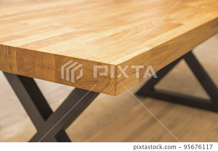 tabletop close-up where you can see glued together wood blocks 95676117