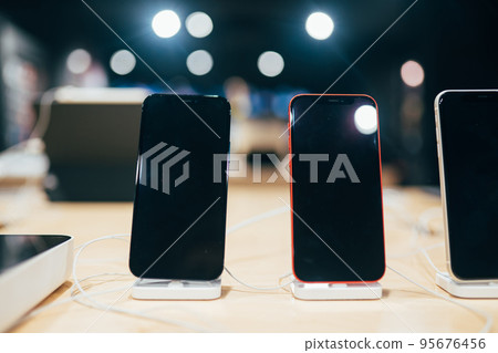 smartphones on the dock at store, close view smartphones on the dock at store, close view 95676456
