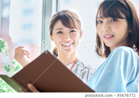 Two businesswomen meeting in the office Two businesswomen meeting in the office 95676772