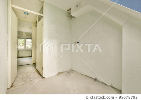 Perspective view of empty narrow hallway with white walls and parquet floor in minimalist style apartment Perspective view of empty narrow hallway with white walls and parquet floor in minimalist style apartment 95678792