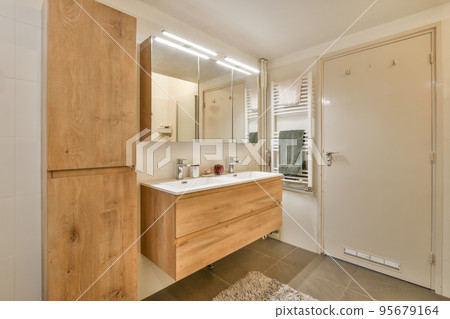 Interior of contemporary bathroom with shower and sink in minimal style in flat Interior of contemporary bathroom with shower and sink in minimal style in flat 95679164