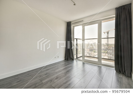 Interior of empty white kitchen with corridor and wooden parquet floor 95679504