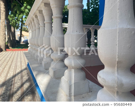 Beautiful old fashioned classic white balcony railings 95680449