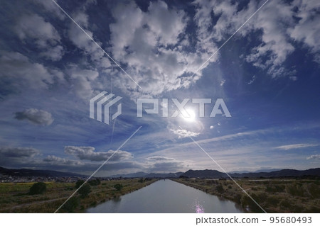 A refreshing morning sky with various clouds and contrails and a river flowing through the plains・Autumn・Super wide angle・Sky mainly・221011am A refreshing morning sky with various clouds and contrails and a river flowing through the plains・Autumn・Super wide angle・Sky mainly・221011am 95680493