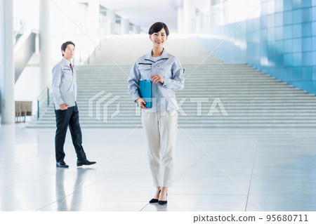 Work staff inspecting the construction site 95680711