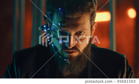 Young bearded guy in black leather jacket looks fiercely at the camera Cyberpunk 95681503