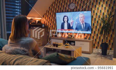 Couple watching politics news about sanctions Couple watching politics news about sanctions 95681991
