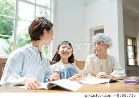 Three-generation family, children, studying 95683716