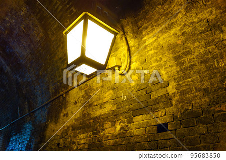 Lights in an old tunnel 95683850