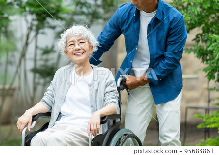 Senior couple wheelchair elderly care 95683861