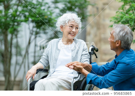 Senior couple wheelchair elderly care 95683865