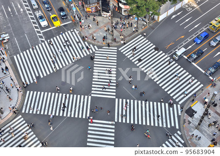 Pedestrians crossing the Sukiyabashi scrambled intersection Pedestrians crossing the Sukiyabashi scrambled intersection 95683904