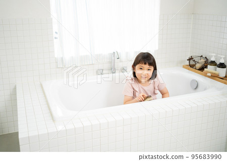 Girl helping to clean the bath 95683990