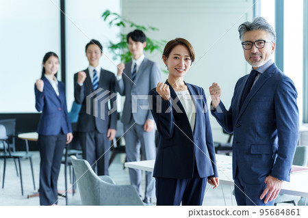 Portrait of a business person doing a guts pose 95684861