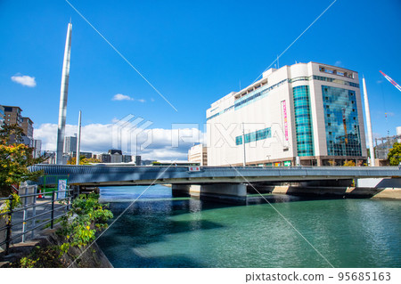This is the urban landscape around the Ekimae Ohashi Bridge on the south side of Hiroshima Station. You can see characteristic columnar towers, hotels, and department stores. Hiroshima 95685163