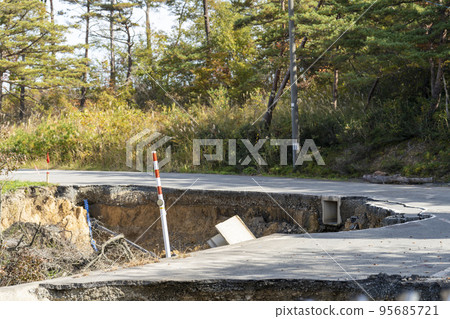 Scars of the disaster Slope of the road washed away by the heavy rain disaster Kawanishi Town, Yamagata Prefecture 95685721