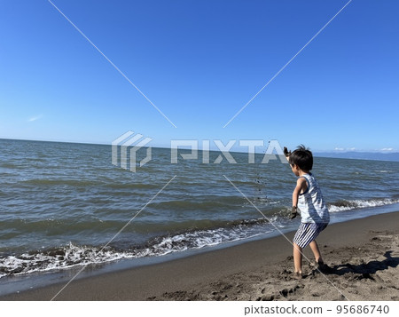 A boy swimming in the sea 95686740