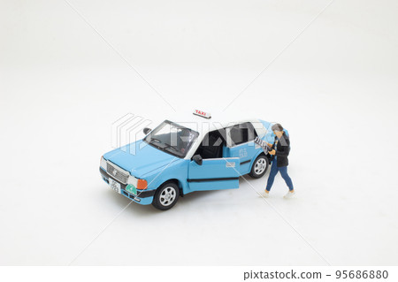 a figure man near cab reading information from daily press 95686880