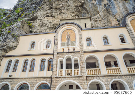 Monastery of Ostrog, Serbian Orthodox Church situated against a vertical background, high up in the large rock of Ostroska Greda, Montenegro. Dedicated to Saint Basil of Ostrog Monastery of Ostrog, Serbian Orthodox Church situated against a vertical background, high up in the large rock of Ostroska Greda, Montenegro. Dedicated to Saint Basil of Ostrog 95687660