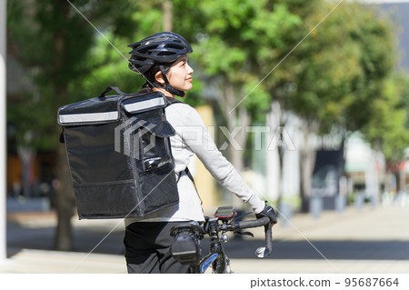 Food delivery delivery woman back view 95687664