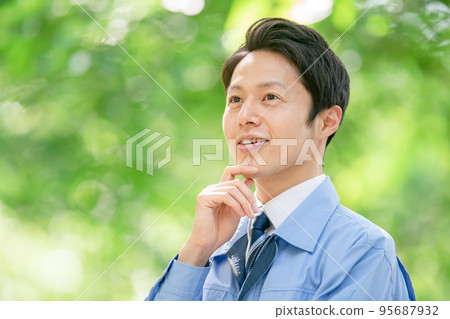 Men in work clothes outdoor fresh green real estate architecture 95687932