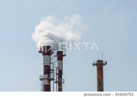 Close-up of smoke coming out of factory chimney 95689783