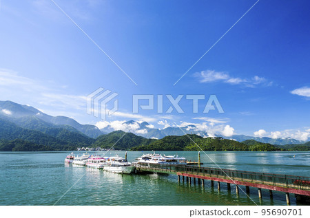 The scenery of the Yacht Marina at Sun Moon Lake in the morning is a famous attraction in Nantou, Taiwan. The scenery of the Yacht Marina at Sun Moon Lake in the morning is a famous attraction in Nantou, Taiwan. 95690701