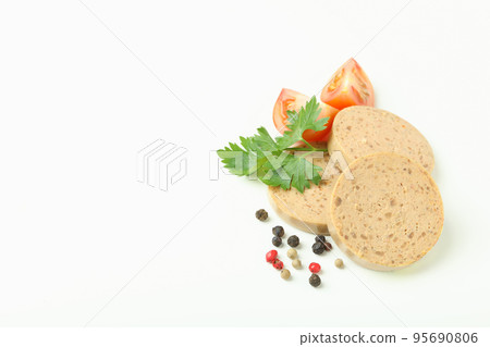 Liverwurst slices, tomato, pepper and parsley  on white background 95690806