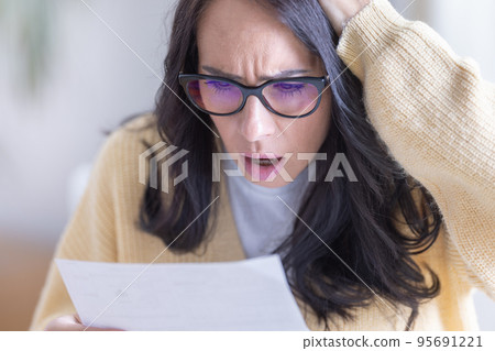 Woman shocked by the information she reads from the letter 95691221