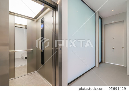 Corridor with passenger lift. Interior of modern residential building. Corridor with passenger lift. Interior of modern residential building. 95691429