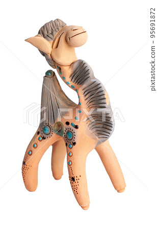 A camel, clay oriental souvenir on a white background 95691872