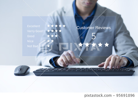 Satisfaction and customer service survey concept, business people using  laptop. to answer the questionnaire And the satisfaction rating, the satisfaction rating with the icon 5 stars. 95691896