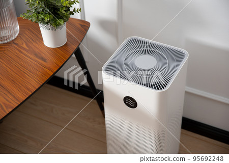 Air purifier in living room, dust protection 95692248