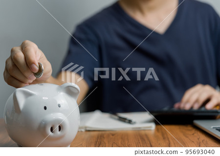 Banking savings money investing insurance planning real real estate support relationship parent economic income budget.hand putting money coin into piggy. 95693040