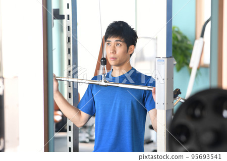 young man training in the gym 95693541