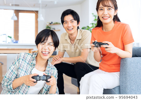 Friends men and women share house lifestyle living room Friends men and women share house lifestyle living room 95694043