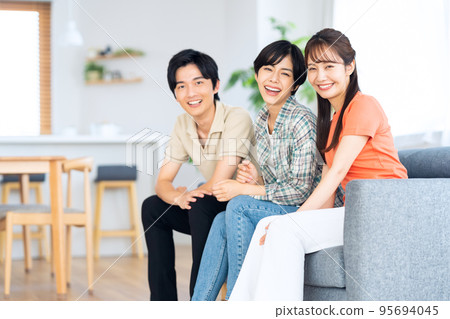 Friends men and women share house lifestyle living room Friends men and women share house lifestyle living room 95694045