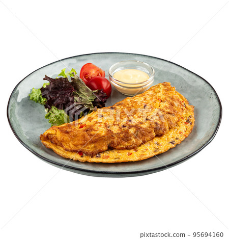 Portion of omelette with salad and sauce 95694160