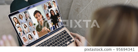 Young woman wave hi to coworkers connected online via video call, remote conference 95694341