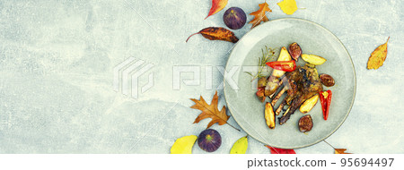 Tasty lamb meat with figs,space for text 95694497