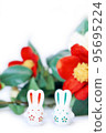 Rabbit figurine and camellia 95695224