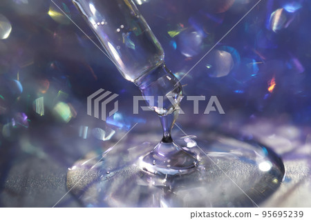 A pipette with a drop of serum in a Christmas theme . A pipette with a drop of serum in a Christmas theme . 95695239