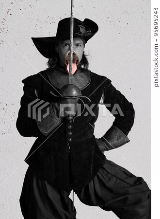 Creative art collage. Portrait of brutal man, medieval pirate in hat with dog's muzzle holding sword. Black and white photo Creative art collage. Portrait of brutal man, medieval pirate in hat with dog's muzzle holding sword. Black and white photo 95695243