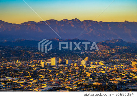 Sunset above downtown Glendale and San Gabriel Mountains in California 95695384