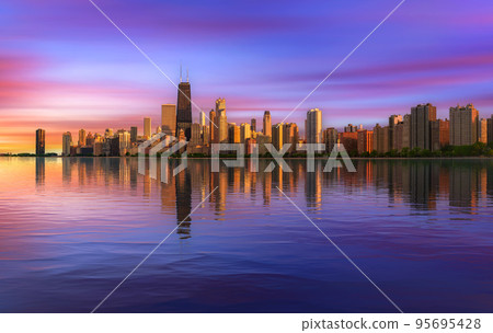 Colorful sunset above Chicago skyline across Lake Michigan 95695428