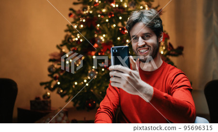 Boy is making a Christmas Video Call 95696315