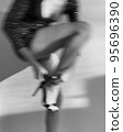 Slim young woman dancing at home 95696390