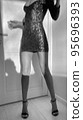 Slim young woman dancing at home 95696393