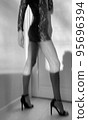 Slim young woman dancing at home 95696394
